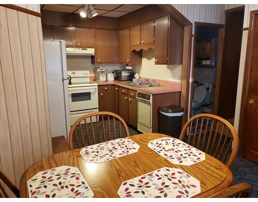 6 Arthur Avenue Lowell, MA 01854 - Photo 4 of 8 a kitchen with a sink appliances and cabinets