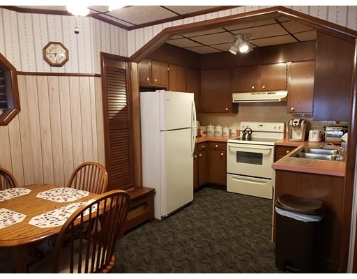 6 Arthur Avenue Lowell, MA 01854 - Photo 5 of 8 a kitchen with a refrigerator and a stove