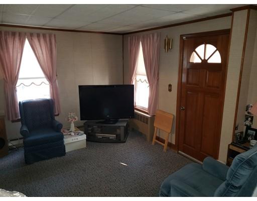 6 Arthur Avenue Lowell, MA 01854 - Photo 6 of 8 a living room with furniture and a flat screen tv