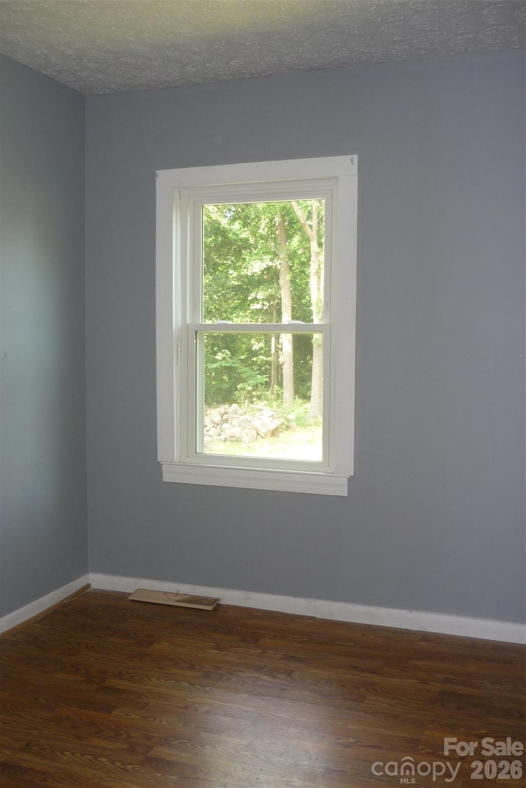 120 Bradley Road Shelby, NC 28152 - Photo 32 of 42 a view of an empty room with wooden floor and a window