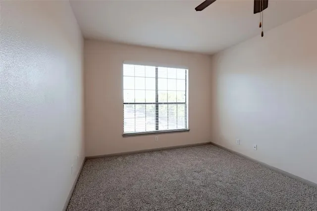 an empty room with a bathroom
