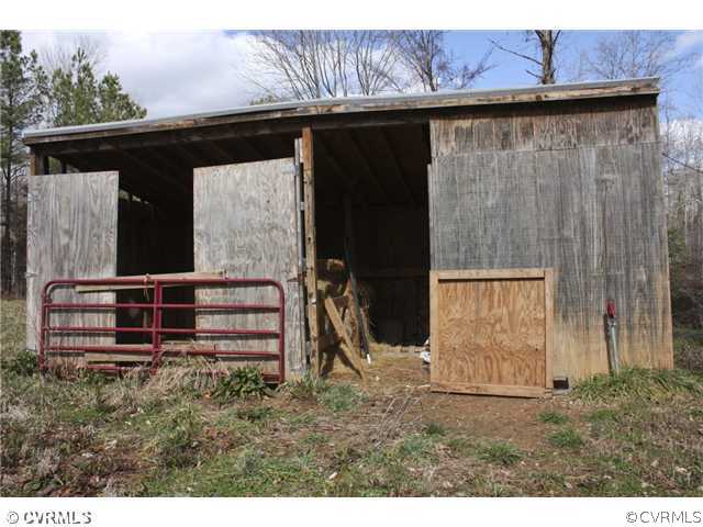 7925 Claystreet Road Ford, VA 23850 - Photo 11 of 13 a view of backyard with cabin