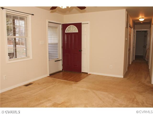 7925 Claystreet Road Ford, VA 23850 - Photo 4 of 13 a view of an empty room with closet and a window