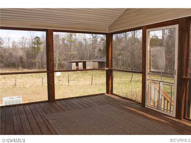 7925 Claystreet Road Ford, VA 23850 - Photo 6 of 13 a view of an empty room with wooden floor and a window