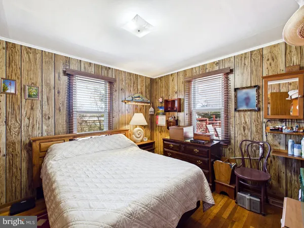 a bed room with a bed and a large window