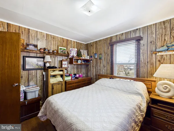 a bed room with bed and window