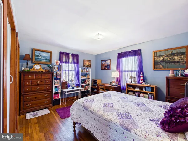 a bed room with a bed and a television