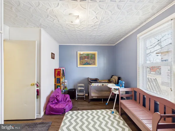 a bedroom with furniture and a window