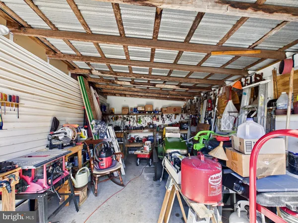 a store room with lots of furniture and clutter