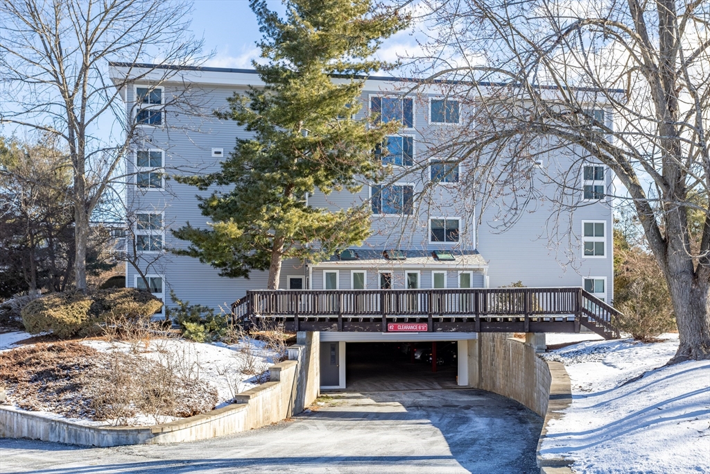 255 North Road, Unit 172 Chelmsford, MA 01824 - Photo 12 of 29 a view of a house with a balcony