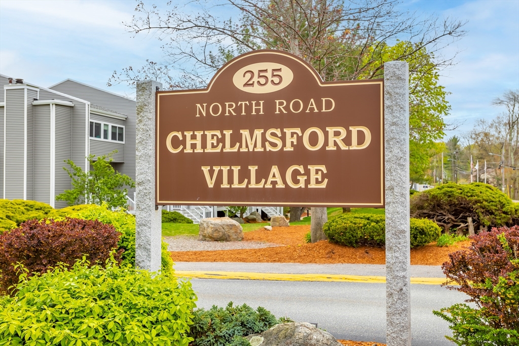 255 North Road, Unit 172 Chelmsford, MA 01824 - Photo 13 of 29 a sign broad on the side of the road