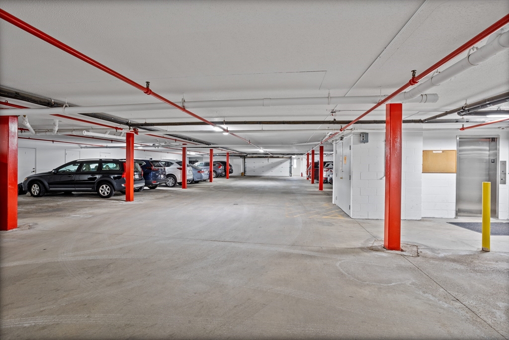 255 North Road, Unit 172 Chelmsford, MA 01824 - Photo 20 of 29 a view of parking garage with cars