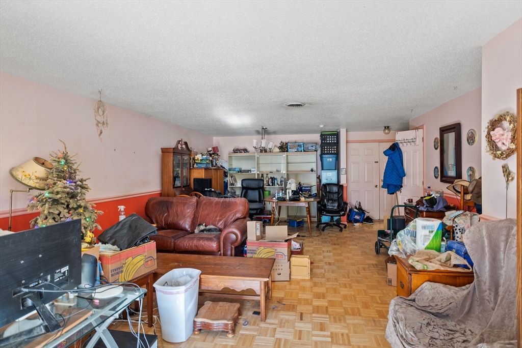 255 North Road, Unit 172 Chelmsford, MA 01824 - Photo 22 of 29 a living room with furniture and a flat screen tv