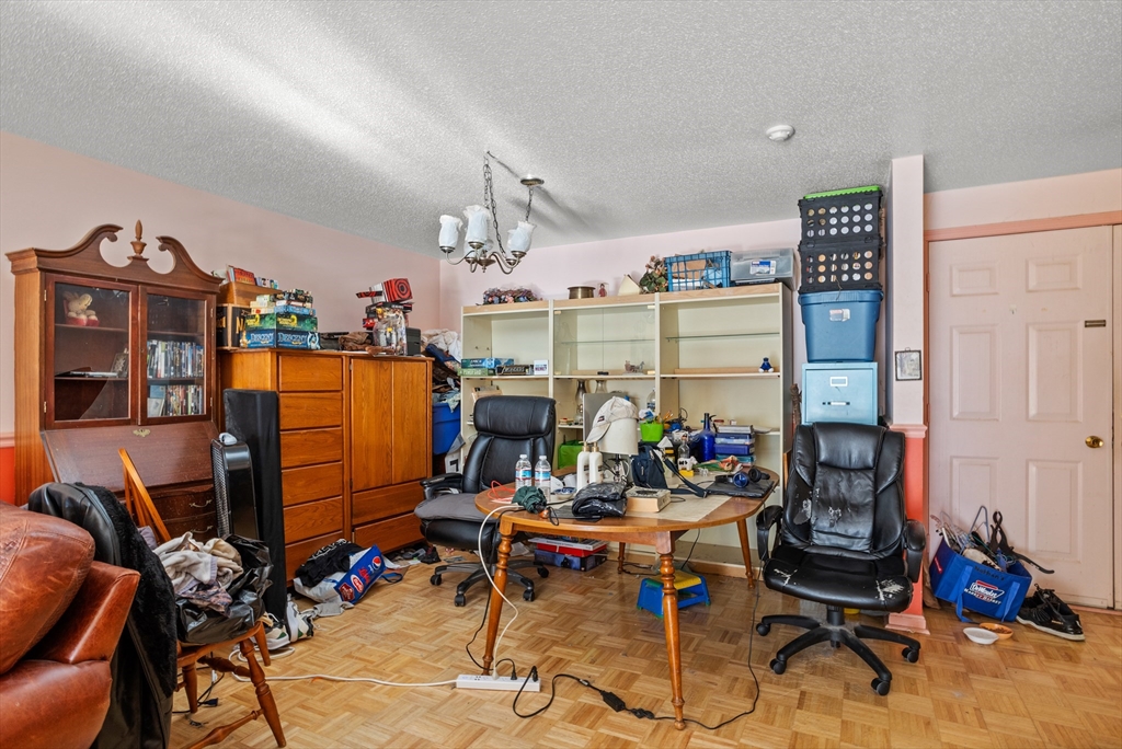 255 North Road, Unit 172 Chelmsford, MA 01824 - Photo 23 of 29 a room with gym equipment and a table