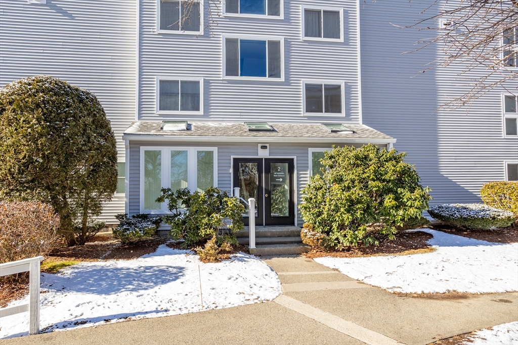 255 North Road, Unit 172 Chelmsford, MA 01824 - Photo 5 of 29 a view of a house with potted plants