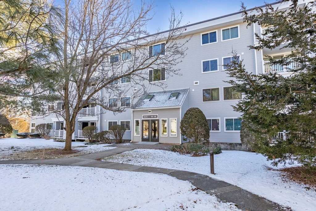 255 North Road, Unit 172 Chelmsford, MA 01824 - Photo 6 of 29 a front view of a building with large trees