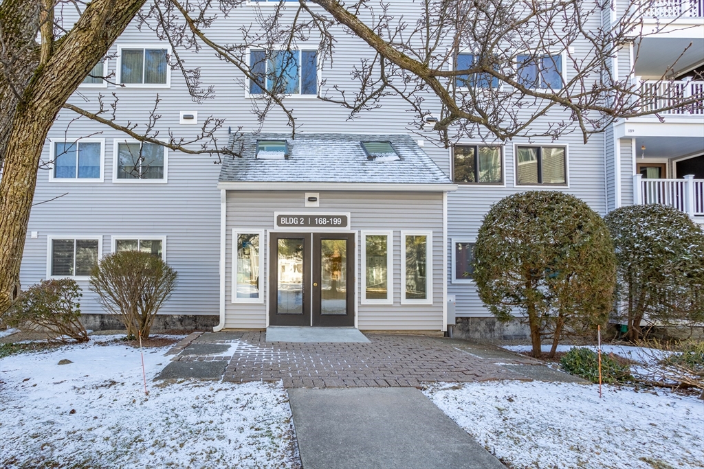 255 North Road, Unit 172 Chelmsford, MA 01824 - Photo 9 of 29 a front view of a house with garden