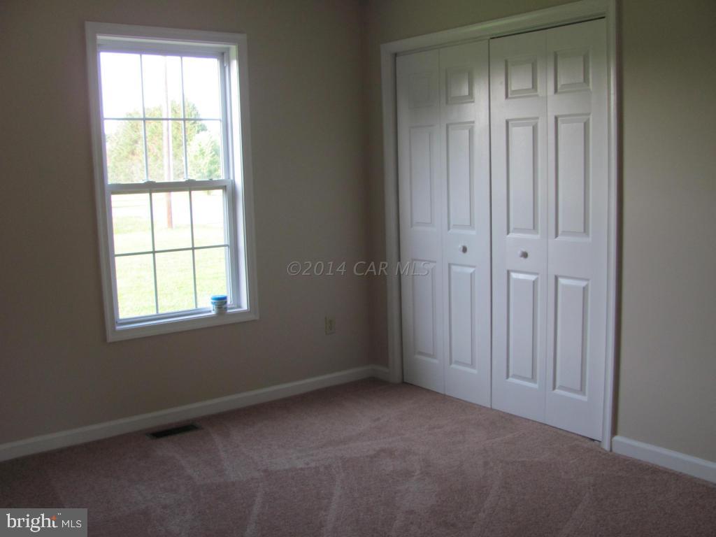 27105 Walnut Tree Road Salisbury, MD 21801 - Photo 17 of 21 an empty room with windows
