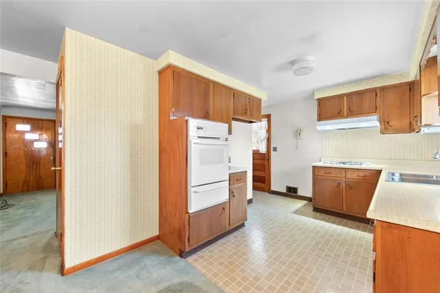 a room with furniture and a refrigerator