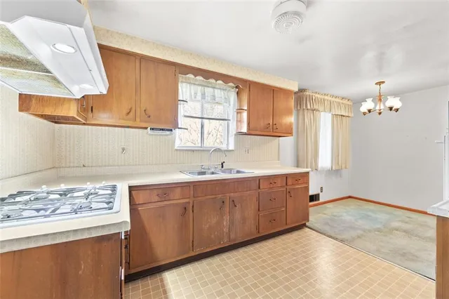 a spacious bathroom with a granite countertop sink a mirror and a bathtub