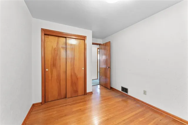 a view of room with window and hardwood floor