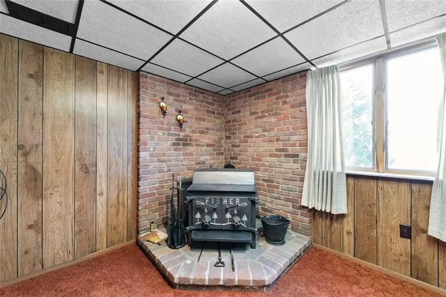 a kitchen with a stove and a shower