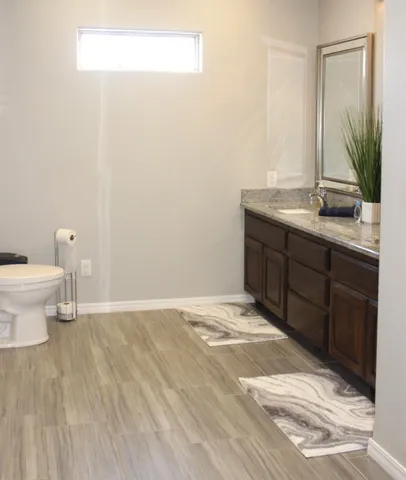 a bedroom with a bed a flat screen tv and closet