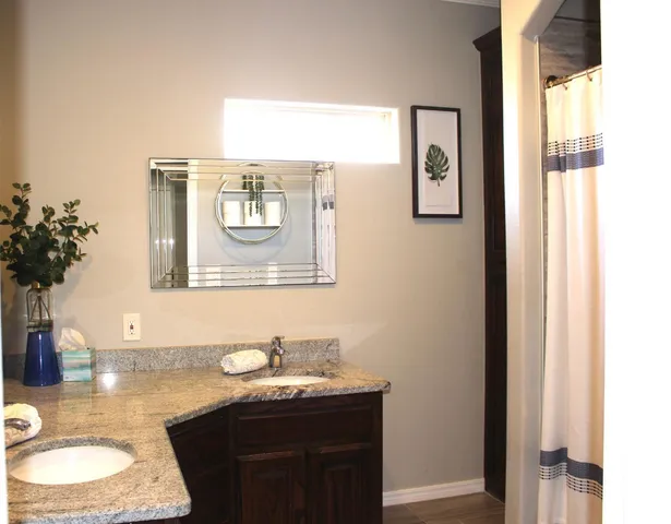 a room with a sink and a mirror