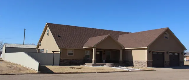 a front view of a house with a garage