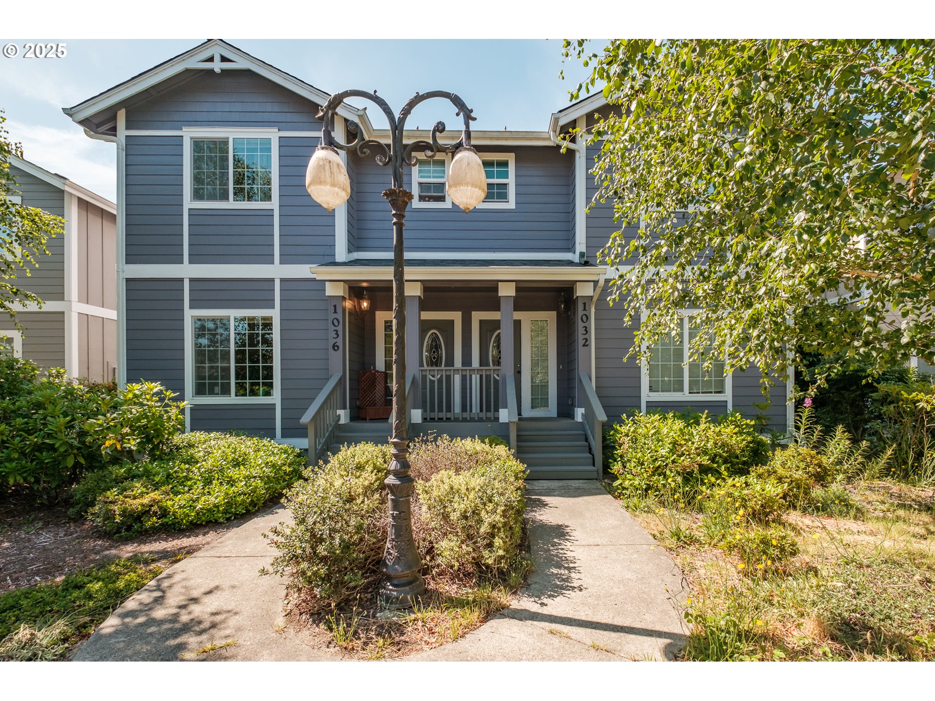 a front view of a house with garden