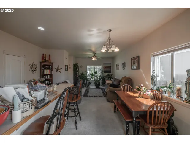 a kitchen with kitchen island a sink stainless steel appliances and cabinets