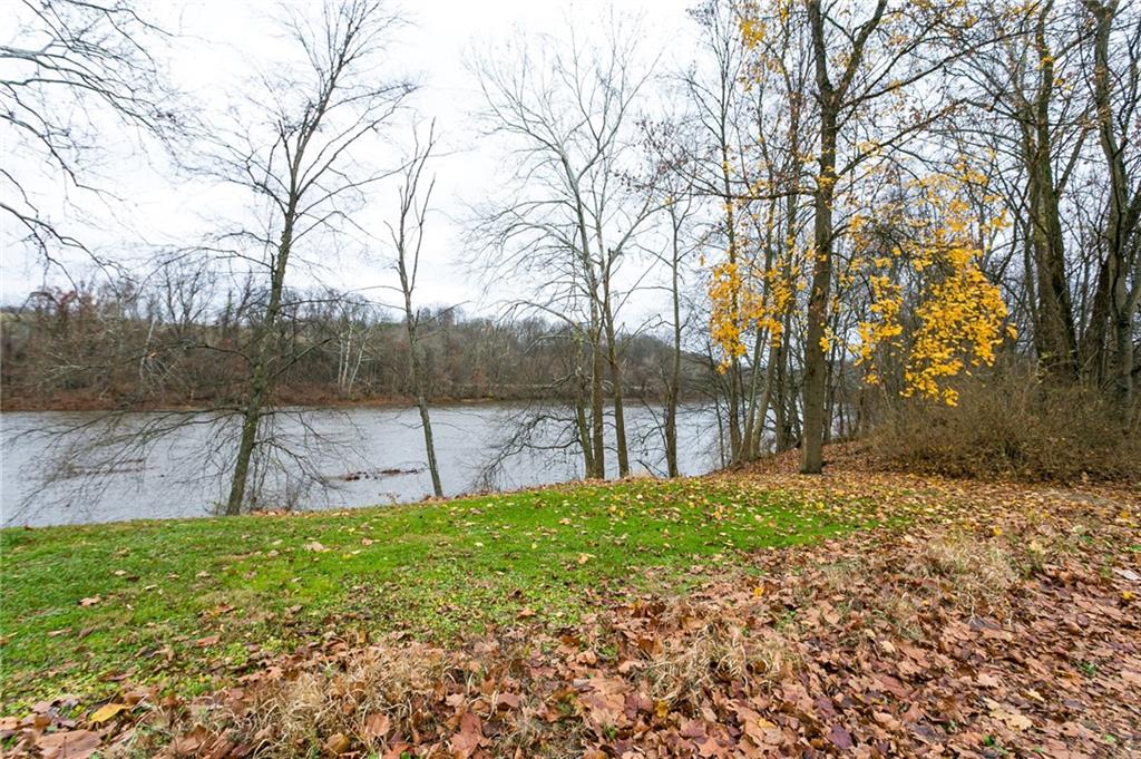 Tr495 River Road Perryopolis, PA 15473 - Photo 11 of 12 a view of a backyard with large trees