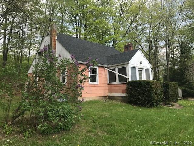 259 Woodville Road Warren, CT 06777 - Photo 1 of 1 a front view of a house with a yard