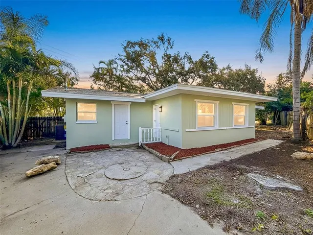 a house with trees in the background