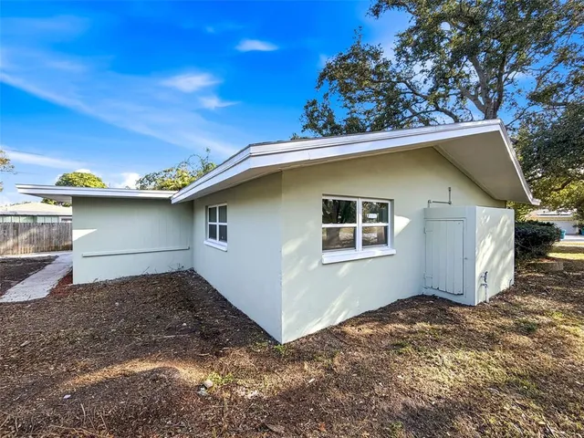 a house with a tree in the background