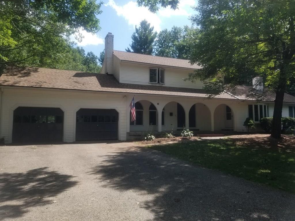 42 Bushy Lane Rutland, MA 01543 - Photo 1 of 31 a front view of a house with garden