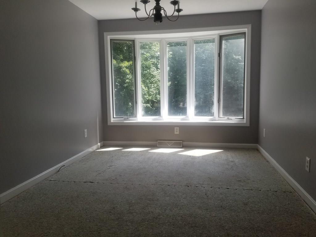 42 Bushy Lane Rutland, MA 01543 - Photo 11 of 31 a view of an empty room with a window