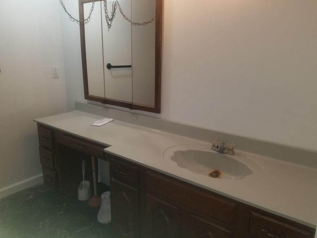 42 Bushy Lane Rutland, MA 01543 - Photo 17 of 31 a bathroom with a sink and a mirror