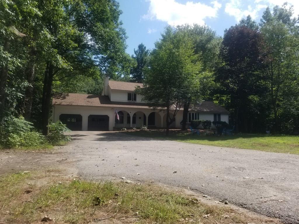 42 Bushy Lane Rutland, MA 01543 - Photo 2 of 31 a front view of a house with a yard