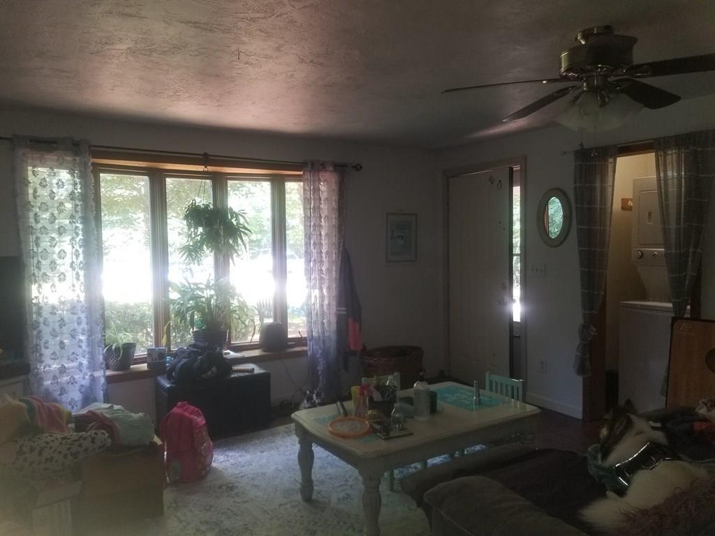 42 Bushy Lane Rutland, MA 01543 - Photo 23 of 31 a living room with furniture and a large window