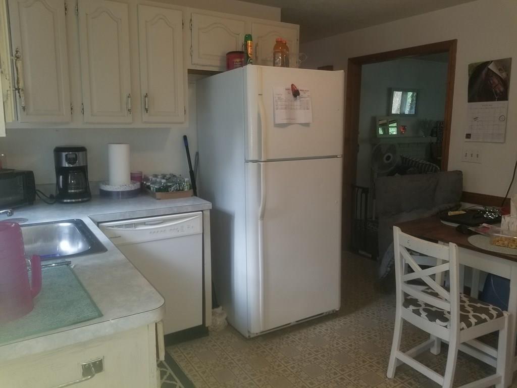 42 Bushy Lane Rutland, MA 01543 - Photo 24 of 31 a kitchen with a refrigerator a stove and a sink