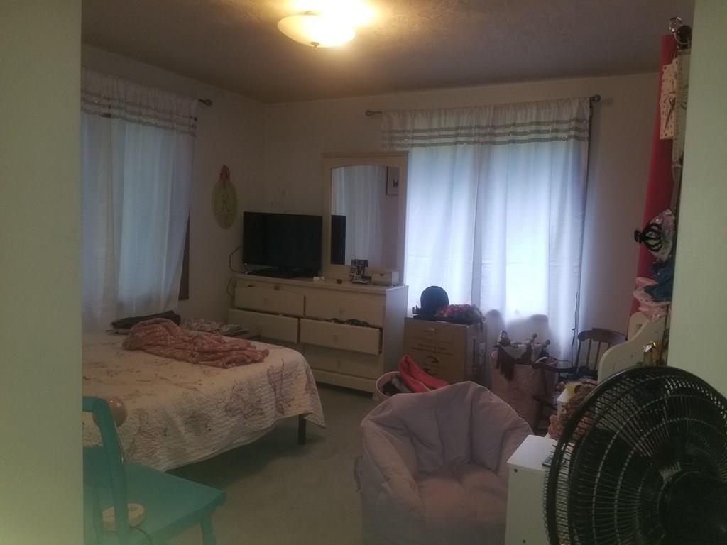 42 Bushy Lane Rutland, MA 01543 - Photo 27 of 31 a living room with furniture and a flat screen tv