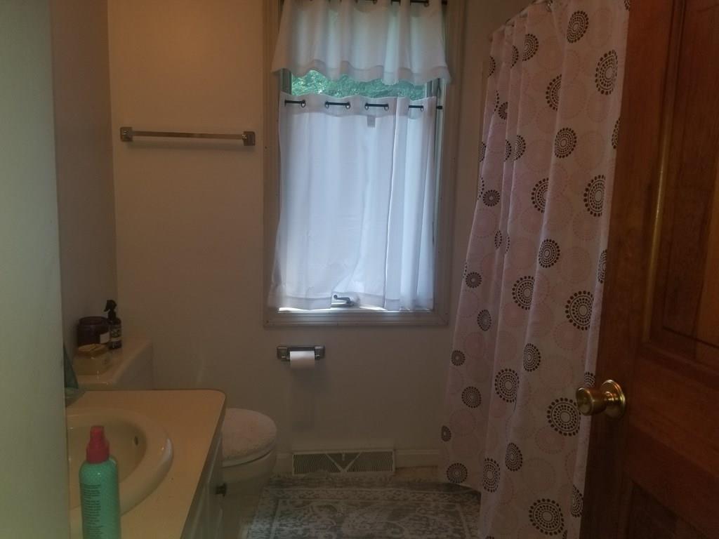42 Bushy Lane Rutland, MA 01543 - Photo 29 of 31 a bathroom with a toilet and shower