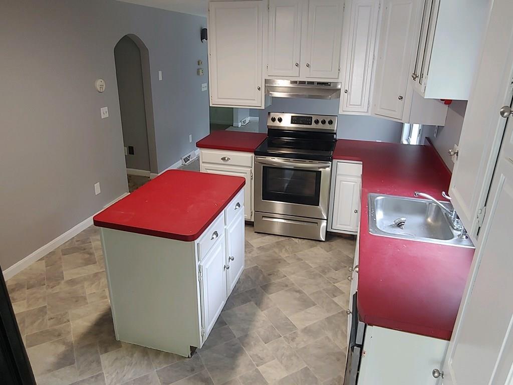 42 Bushy Lane Rutland, MA 01543 - Photo 8 of 31 a kitchen with stainless steel appliances granite countertop a stove a refrigerator and a more cabinets