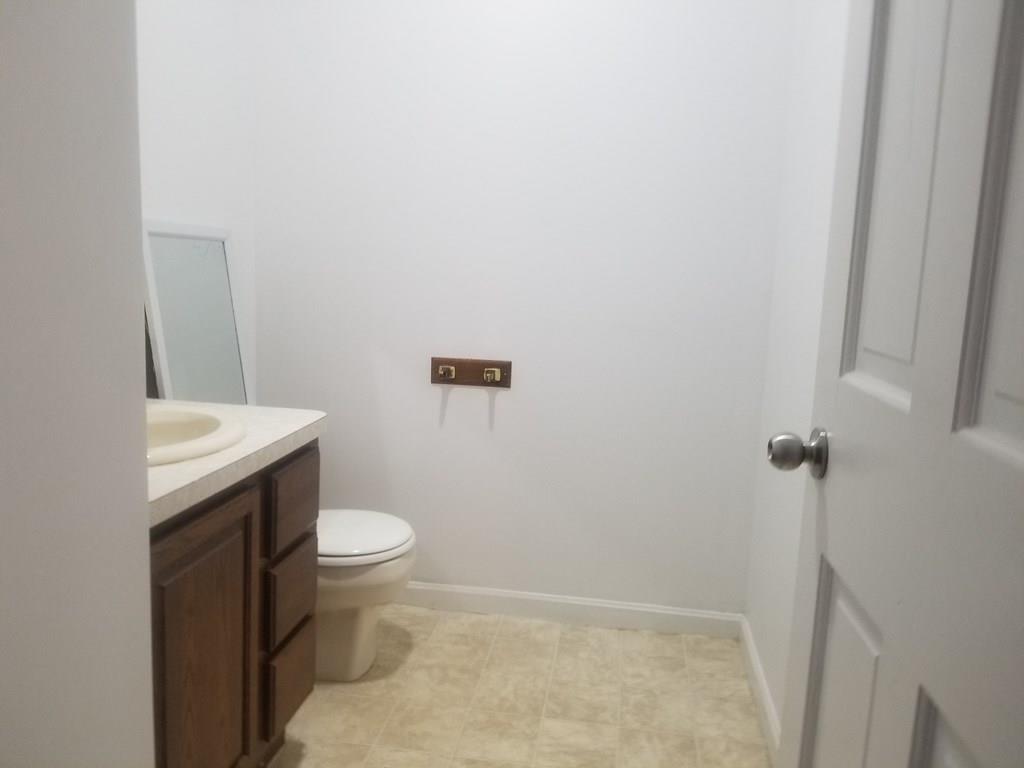 42 Bushy Lane Rutland, MA 01543 - Photo 9 of 31 a bathroom with a toilet and a sink