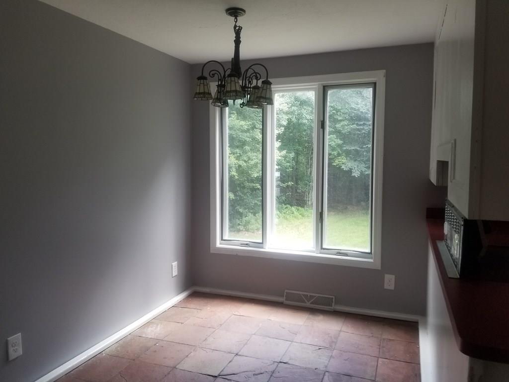 42 Bushy Lane Rutland, MA 01543 - Photo 10 of 31 a view of an empty room with a window