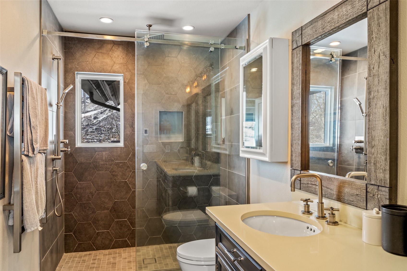 31655 Sugar Ridge Road Steamboat Springs, CO 80487 - Photo 49 of 49 a bathroom with a sink a toilet and shower