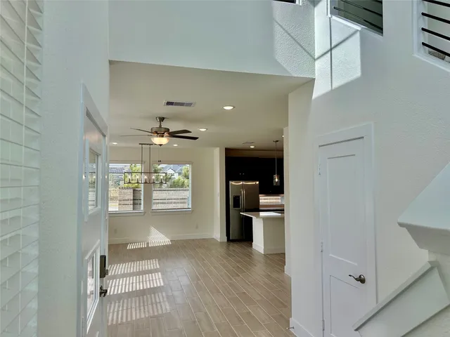 wooden floor in an empty room with a fireplace