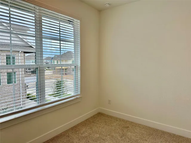 a view of a window in an empty room