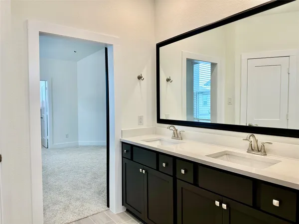 a bathroom with a bathtub and a sink